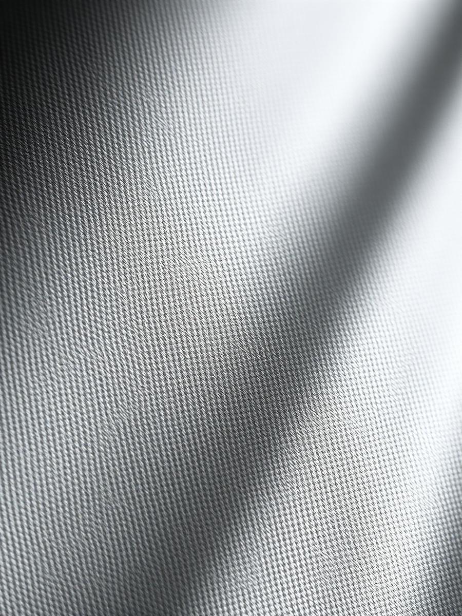 Macro view of woven cotton twill with a precise stitch line